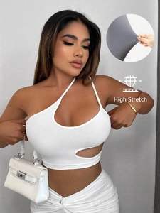 Witte high stretch crop top voor dames met sexy asymmetrische halslijn en cutout design