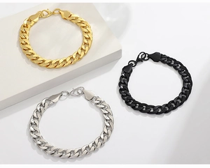 Close-up of cuban link bracelets in gold, silver, and black with secure lobster clasps