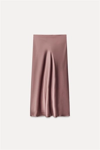 Detail of satin midi skirt fabric in dusty rose showing silky texture and smooth drape
