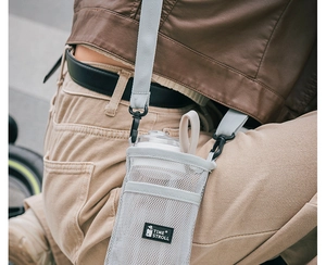 Detail of light grey mesh water bottle holder with adjustable strap for outdoor cycling
