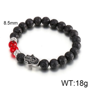 Detail of 8.5mm black lava stone beads and silver Hamsa Hand charm on a vintage bracelet