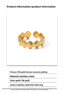 Detailed macro view of an 18k gold-plated stainless steel ring with shell patterns