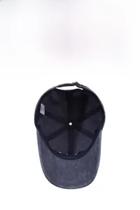 Detail view showing the reinforced inner seams and size label of the washed cotton baseball cap