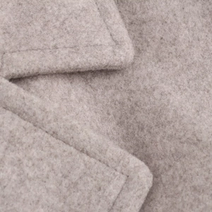 Close-up of grey wool coat collar showing fabric texture and neat stitching detail