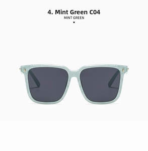 Detail view of large square mint green sunglasses with dark grey lenses and C04 frame