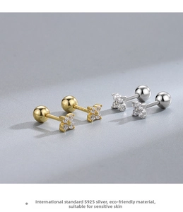Macro detail of S925 sterling silver four-leaf clover earrings with secure screw backs