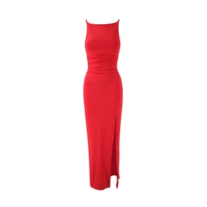 Detailed view of the red slim-fit dress featuring ruched waist and high side slit detail