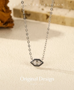 Macro detail of s925 silver hexagonal necklace with black enamel and rectangle zircon