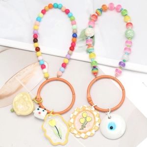 Detailed close-up of colorful dopamine beaded keychains with tulip and heart charms