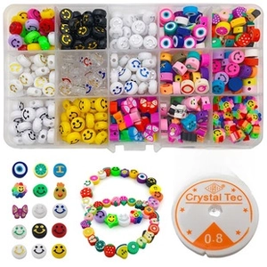 Macro detail of 15-grid DIY bead set with smiley faces, fruits and 0.8mm crystal string