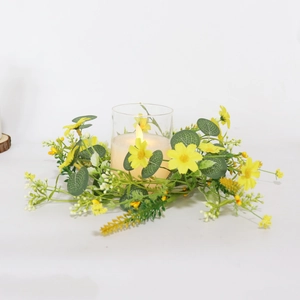 Close-up of yellow daisy eucalyptus candle ring with glass holder and LED candle