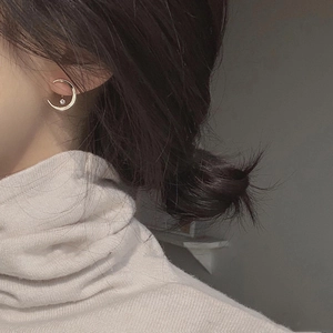 Elegant gold crescent moon earrings with cubic zirconia star pendant on model