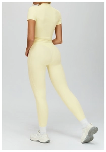 Close-up back view of a light yellow seamless yoga set showing flexible stretch fabric
