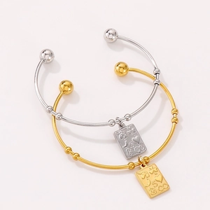 Gold and silver stainless steel open bangles with engraved square charms and lucky symbols