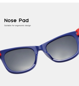 Blue kids sunglasses detail showing ergonomic nose pad and matte frame texture