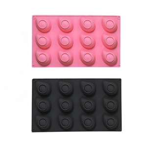 Detail of pink and black 12-cavity silicone molds for jelly, mousse cake and chocolate