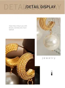 Detailed close-up of gold woven texture C-shape earrings with hanging white pearl