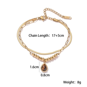 Detail view of gold double-layer stainless steel bracelet with brown gemstone and sizing specs