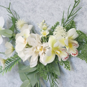 White orchid and daisy floral headpiece with green fern leaves for bridal hairstyles