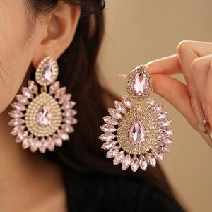 Luxurious pink drop crystal earrings with sunburst rhinestones in gold setting