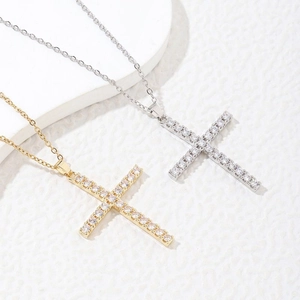 Cross pendant necklace in gold and silver steel pavé-set with sparkling zircon stones