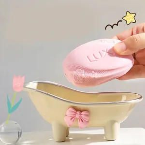 Creative cream bathtub soap dish with pink bow and silver trim for bathroom vanity
