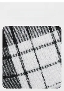 Macro texture of the black and white checkered fabric showing detailed woven fibers