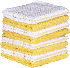 Stack of yellow and white checkered cotton waffle weave kitchen towels with soft texture