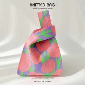 Close-up of pink and purple tulip flower patterns on a high-quality knit tote bag