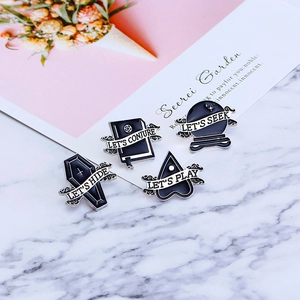 Set of 4 punk Halloween enamel pins featuring coffin and magic book on marble background
