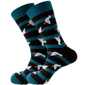 Detail of crew socks with black and green stripes featuring white goose patterns