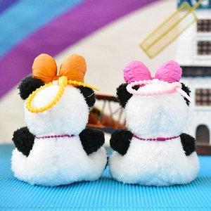 Cute panda plush keychains with colorful orange and pink bow knots shown from behind