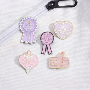 5pcs set of pastel rainbow enamel pins with motivational quotes on white canvas background