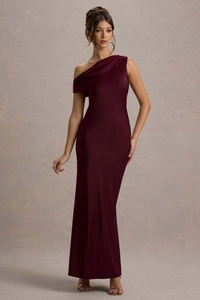 Detail of elegant one-shoulder burgundy satin evening dress with ruched neckline