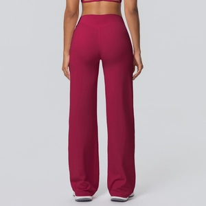Detail of high-waist yoga pants featuring slim-fit V-shaped stitching on back in dark red