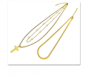 Detail of 18K gold plated titanium steel layered cross pendant and flat snake chain