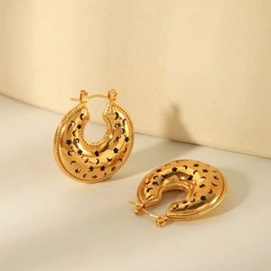 Golden stainless steel hoop earrings featuring intricate hollow star and moon patterns