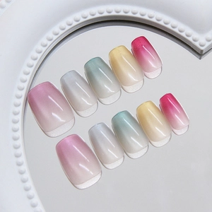 Rainbow cat eye press-on nails with macaron gradient finish and glossy reflections