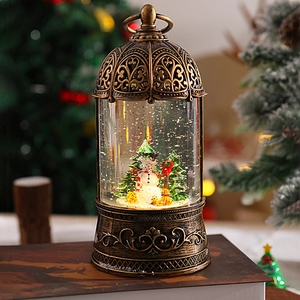 Detail view of a vintage bronze Christmas lantern with snowman and glowing snow globe