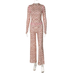 Detail view of leopard print set with pink contrast stitching and slim fit design