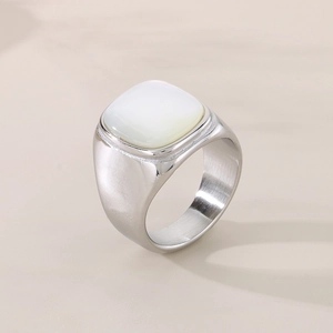 Detail of square white shell inlay on wide band stainless steel ring for men and women