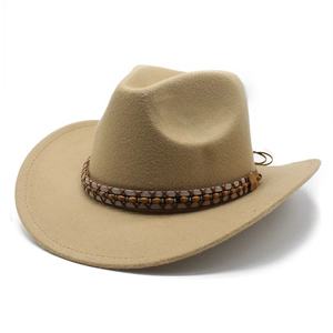 Detail of western cowboy hat with ethnic bead band and stitched brim on khaki felt