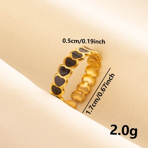 Detailed view of golden heart ring with size markings 0.5cm width and 1.7cm diameter
