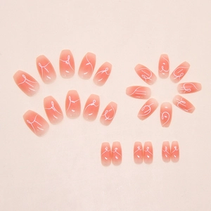 Detail of pink ombre coffin fake nails with minimalist hand-drawn white ribbon lines