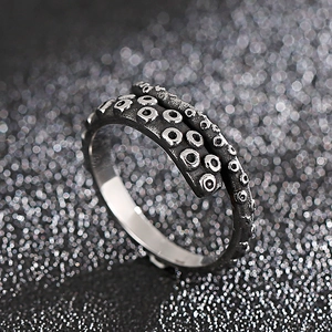 Macro detail of octopus tentacle suckers on a vintage oxidized steel ring