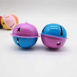Close-up of 4cm dual-color star cutout metal bells for bags and Christmas decor