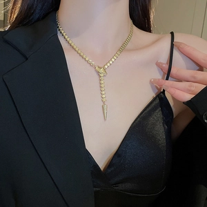 Chic gold-plated Y-shaped snake chain necklace on model wearing black blazer