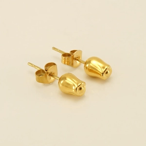 Detailed close-up of golden tulip bud stud earrings with a high-polished metallic finish