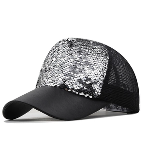 Detail of silver sequins and breathable mesh on a black baseball cap for women
