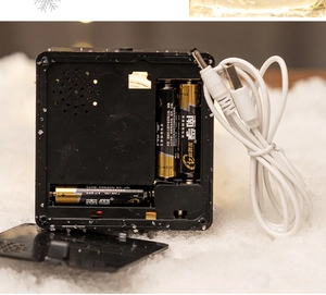 Detail of Christmas lantern battery compartment with USB cable and dual power supply mode